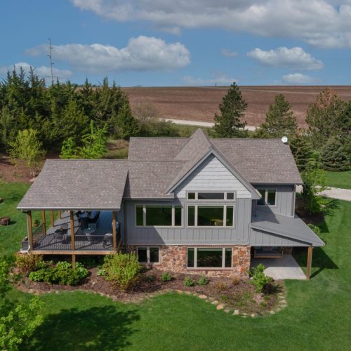 A large house with a big yard in front of it